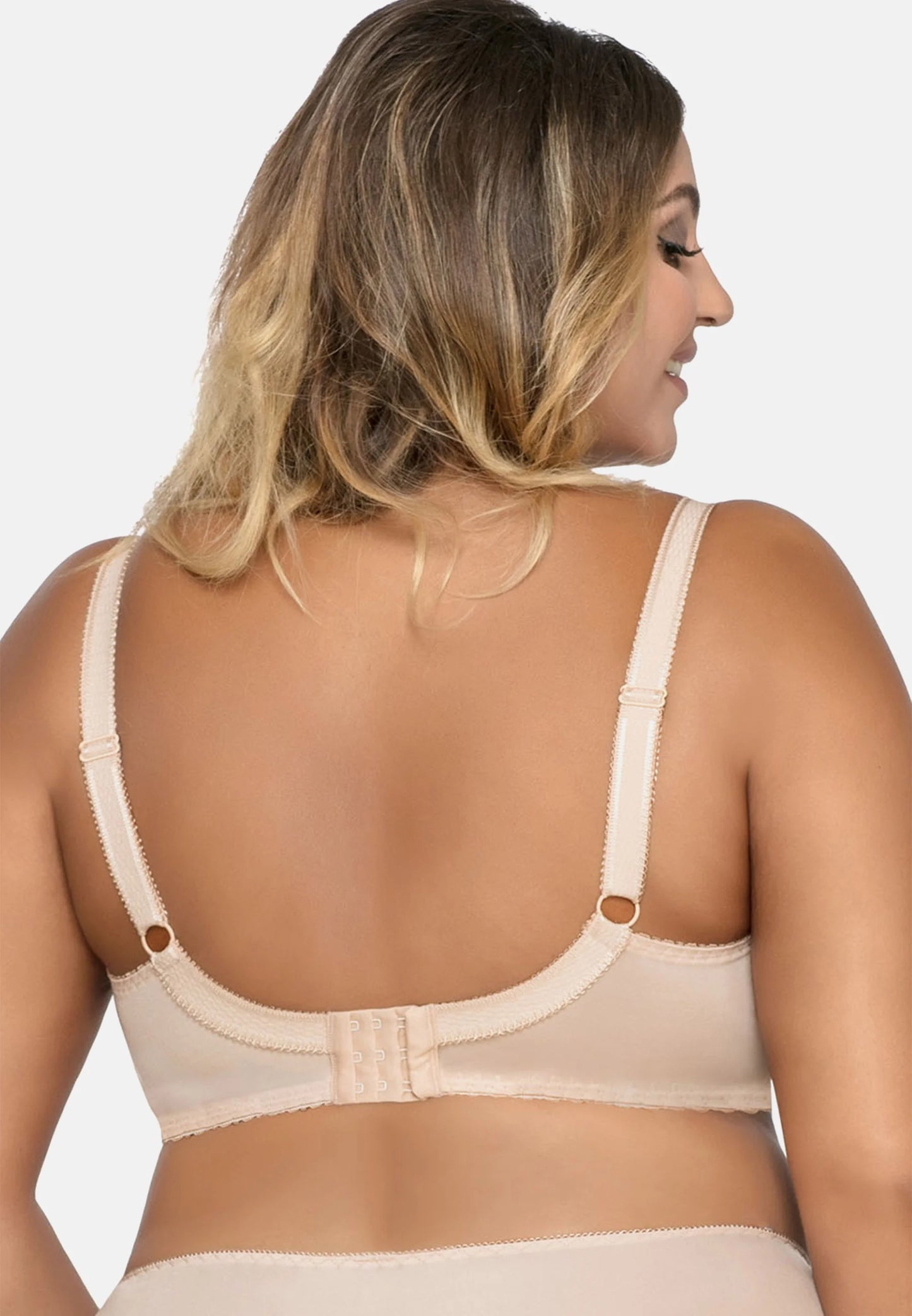 Reggiseno confortevole per seni generosi, con coppe morbide senza ferretto, decorato con pizzo trasparente e coccarda in raso.